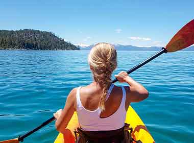 Kayaking on Lake Tahoe with crystal-clear turquoise water