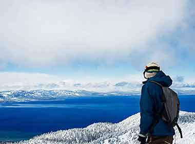 Skiing powder at Lake Tahoe with mountain views